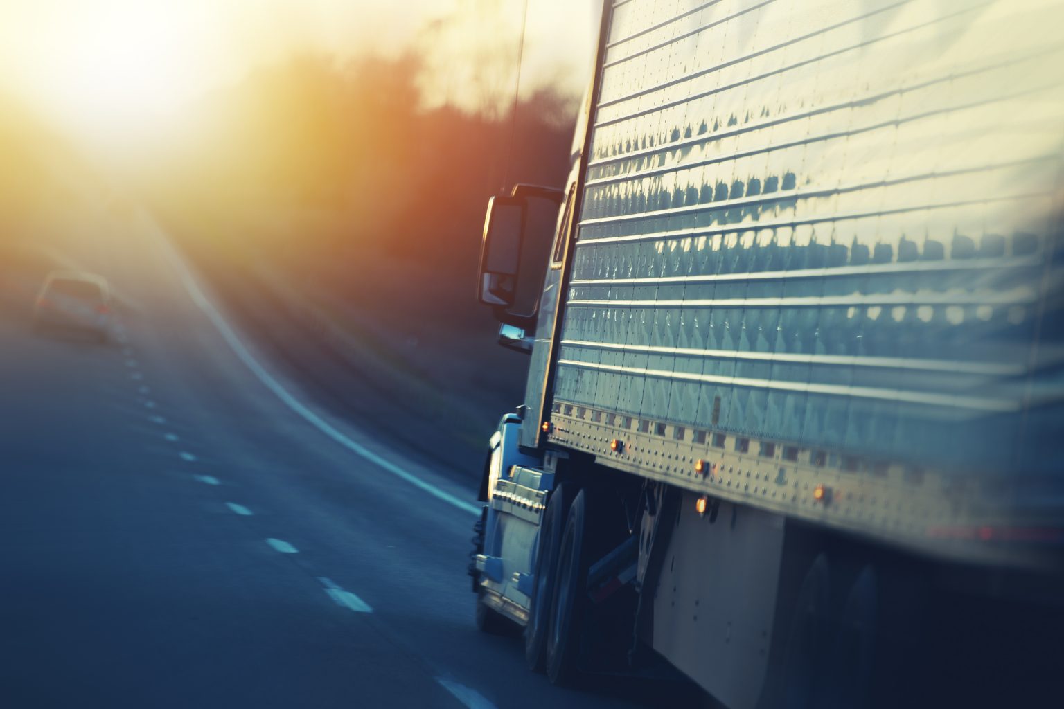 Semi truck driving down a highway